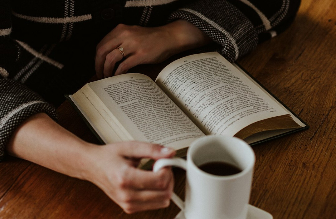 person reading book quietly